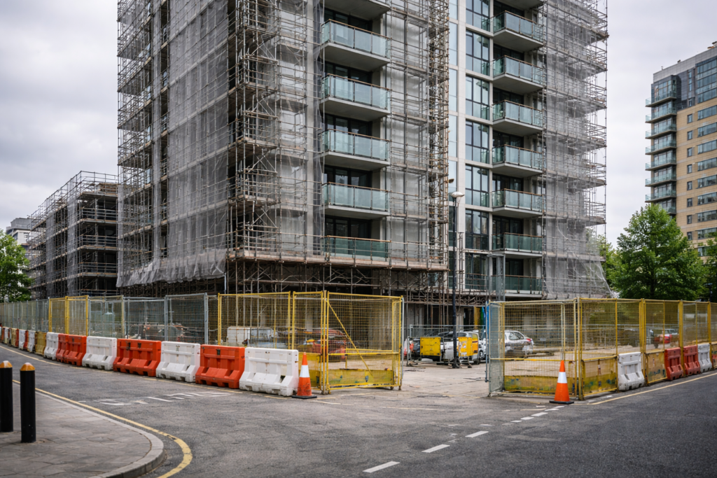 High-rise residential construction site paused for compliance review and resubmission work. Legacy Schemes.