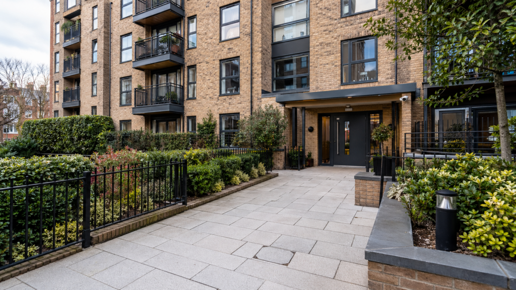 A well-maintained London residential block with clean communal areas, representing higher building and fire safety standards.
