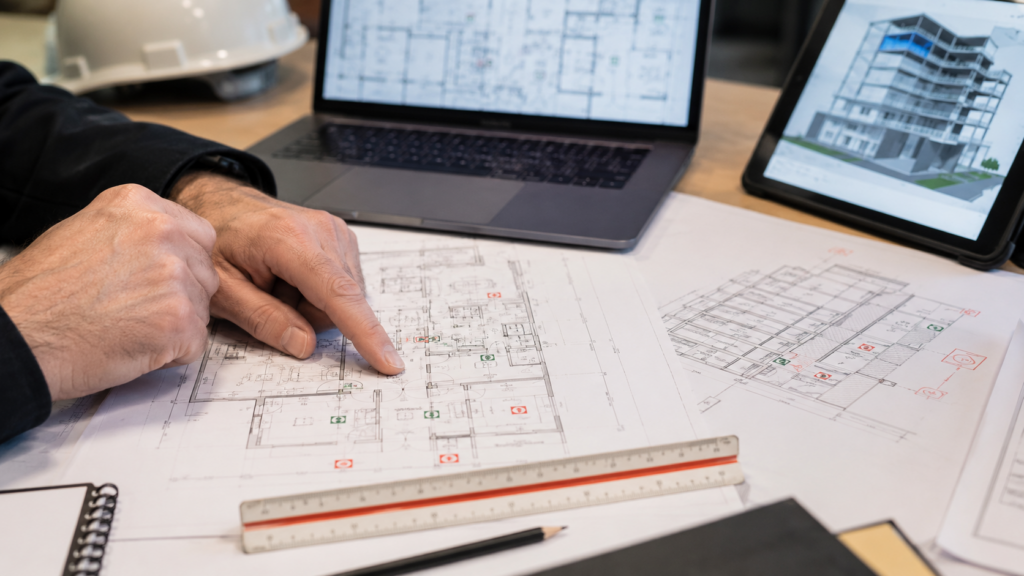 Close-up of building safety plans, architectural drawings and digital models being reviewed for Gateway 2 approval.