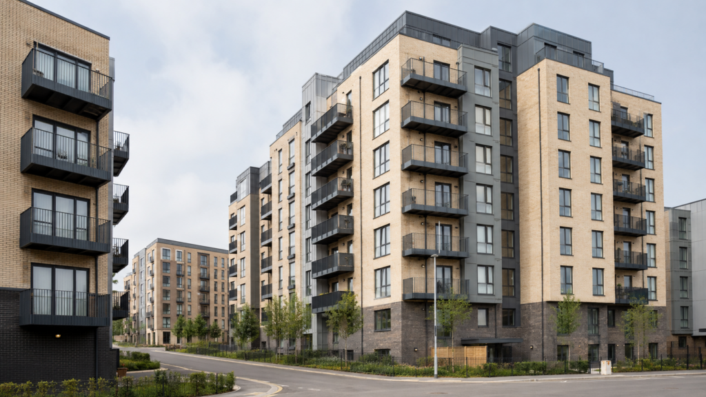 Several realistic medium-rise residential buildings in England, representing the type of homes likely to fall within the new remediation register.